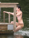 Sexy young starlet Megan Fox goes topless during a scene from the thriller Jennifer's Body shooting in Vancouver.  Fox has some plastic coverings on her nipples as she emerges from the water